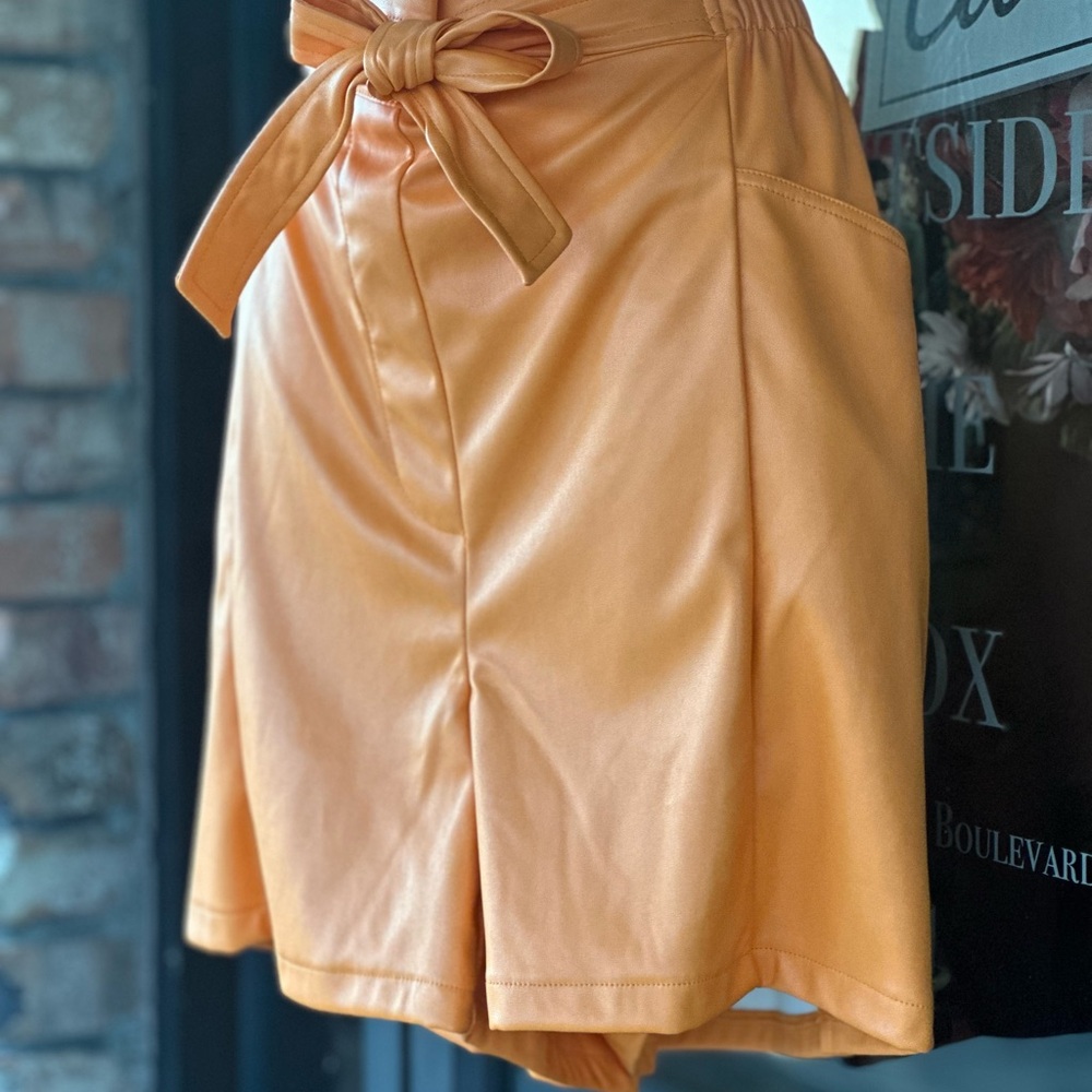 Orange leather shorts